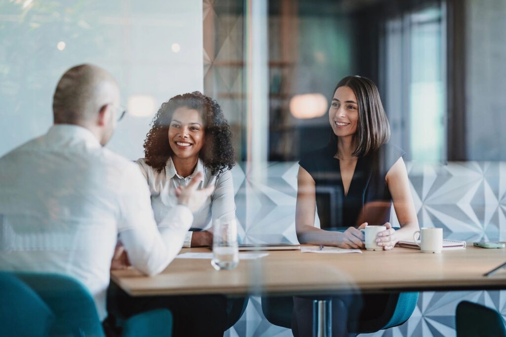 Female entrepreneurs listening to a customer during a meeting